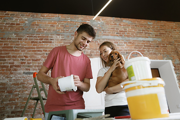 Image showing Young couple doing apartment repair together themselves