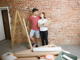 Image showing Young couple doing apartment repair together themselves