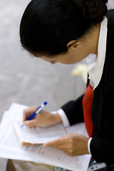Image showing businesswoman is writing