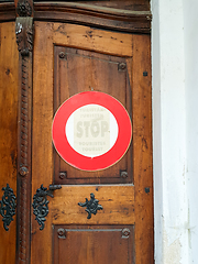 Image showing Sign stop Tourist on door to church.