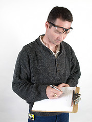 Image showing Male Worker Taking Notes