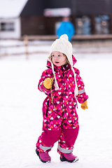 Image showing little girl having fun at snowy winter day