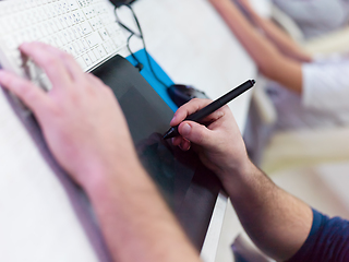 Image showing Closeup of Graphic Designer Working at Workplace