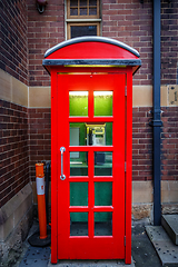 Image showing Vintage UK red phone booth