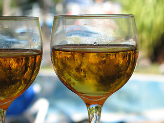 Image showing beer glasses close up in a tropical layout