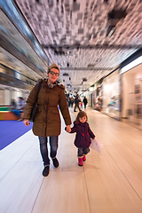 Image showing young mother and her little pretty daughter shopping together