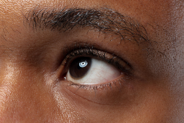 Image showing Close up portrait of young man on blue background.