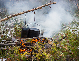 Image showing Cooking on a fire in field conditions