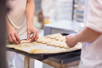 Image showing bakers preparing the dough