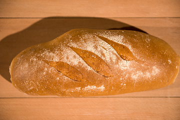 Image showing fresh bread on wooden table