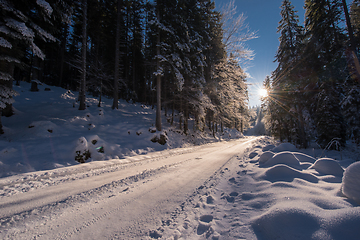 Image showing Snowy country road during  sunset or sunrise