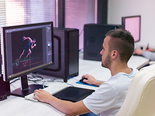 Image showing Graphic Designer Working at Workplace