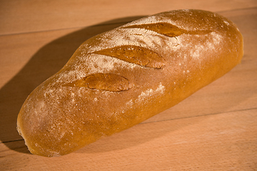 Image showing fresh bread on wooden table