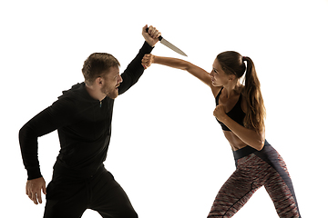 Image showing Man and woman fighting in studio, women\'s self-defense concept