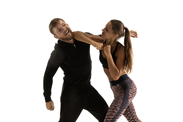 Image showing Man and woman fighting in studio, women\'s self-defense concept