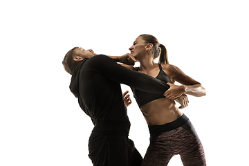 Image showing Man and woman fighting in studio, women\'s self-defense concept