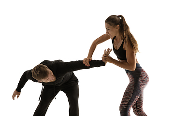 Image showing Man and woman fighting in studio, women\'s self-defense concept