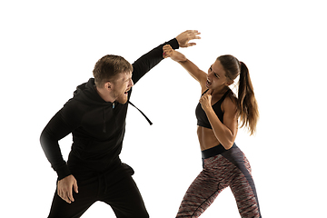 Image showing Man and woman fighting in studio, women\'s self-defense concept