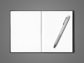 Image showing Blank open notebook and pen isolated on dark grey