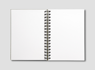 Image showing Blank open spiral notebook isolated on grey