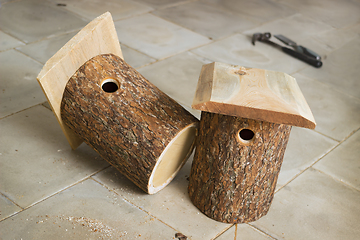 Image showing Two birdhouse of alder logs