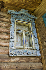 Image showing Window of an old house with carved platbands