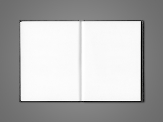 Image showing Blank open notebook isolated on dark grey