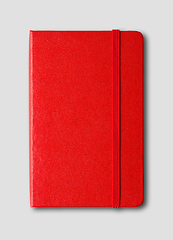 Image showing Red closed notebook isolated on grey