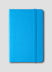 Image showing blue closed notebook isolated on grey