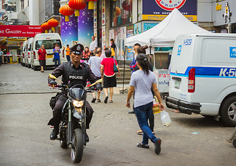 Image showing Policeman on a scooter, Thailand