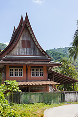 Image showing Little Thai houses and palm trees