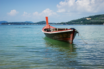 Image showing Thai wooden boat on a calm sea