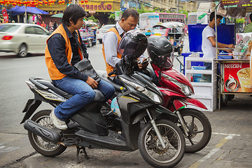 Image showing Taxi drivers on scooters waiting for customers. Thailand