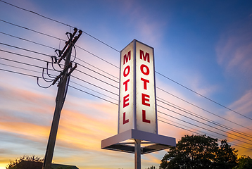 Image showing Vintage motel sign at sunset 