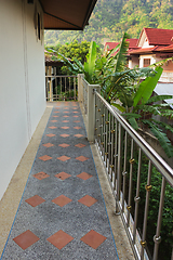 Image showing Balcony of a house overlooking the village and the jungle