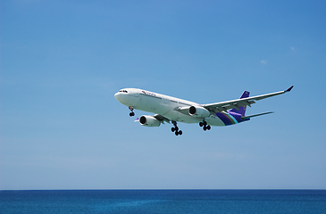 Image showing Airbus A330 of Thaiairway. Landing, flies from the ocean