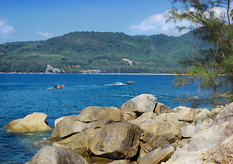 Image showing Thai pleasure boating on a calm sea bay