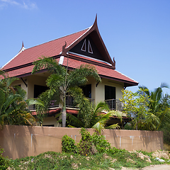 Image showing Little Thai houses and palm trees