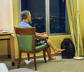 Image showing Tourist looks of the rooms at night Bangkok