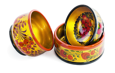 Image showing Three wooden  bowls, painted with floral ornament in style of Khokhloma