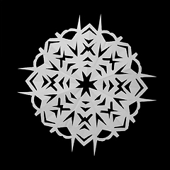 Image showing Paper white snowflake lie on black background