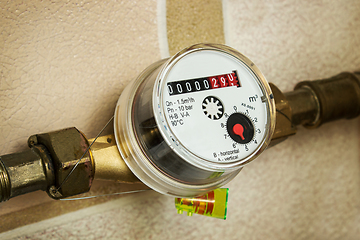 Image showing Water meters installed on pipe and sealed