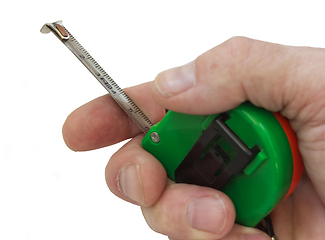 Image showing Tape measure in hand wizard on white