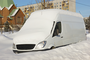 Image showing Car in the snow on the street the northern city in Russia