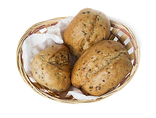 Image showing Oatmeal bun in a small basket, white background