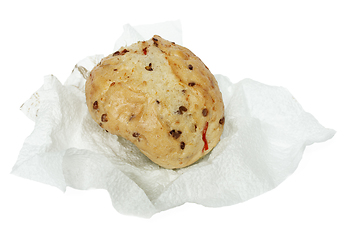 Image showing Bun wheat on a paper napkin on white