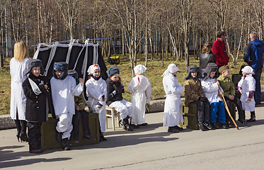 Image showing Children participate in staging immortal Regiment. Polyarnye Zori. Russia