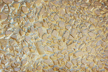 Image showing Concrete panel surface is covered with gravel, painted in brown