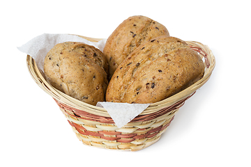 Image showing Three oatmeal buns in a small basket, white background