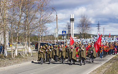 Image showing Immortal Regiment marches at entrance city. Polyarnye Zori. Russia